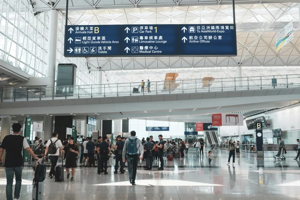 Busy airport terminal concourse